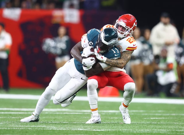 Feb 9, 2025; New Orleans, LA, USA; Philadelphia Eagles wide receiver A.J. Brown (11) is tackled by Kansas City Chiefs cornerback Trent McDuffie (22) in the fourth quarter in Super Bowl LIX at Ceasars Superdome. Mandatory Credit: Mark J. Rebilas-Imagn Images/File Photo