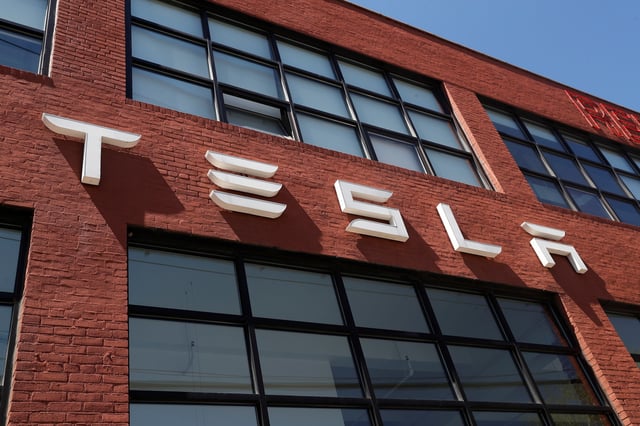 The TESLA logo is seen outside a dealership in the Brooklyn borough of New York City, U.S., April 26, 2021. REUTERS/Shannon Stapleton/ File Photo