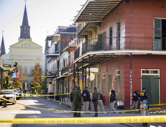 FILE -The FBI investigates the area on Orleans St and Bourbon Street by St. Louis Cathedral in the French Quarter where a suspicious package was detonated after a person drove a truck into a crowd earlier on Bourbon Street on Wednesday, Jan. 1, 2025. (AP Photo/Matthew Hinton, File)
