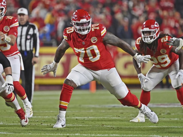 Kansas City Chiefs offensive tackle D.J. Humphries (70) gets set to block during an NFL football game against the Los Angeles Chargers Sunday, Dec. 8, 2024, in Kansas City, Mo.