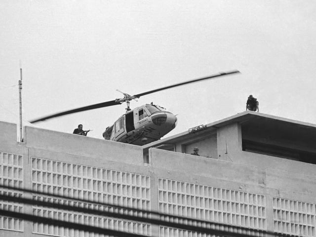 FILE- A U.S. Marine helicopter takes off from helipad on top of the American Embassy in Saigon, Vietnam, April 30, 1975. (AP Photo/Phu, File)