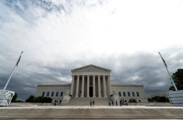 Storm clouds hang over the Supreme Court building in Washington.