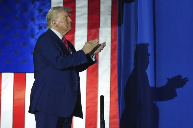 President Donald Trump arrives to speak on his first 100 days at Macomb County Community College Sports Expo Center, Tuesday, April 29, 2025, in Warren, Mich. (AP Photo/Alex Brandon)
