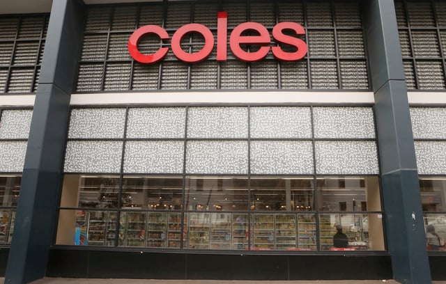 The Coles logo is seen on a facade of a Coles supermarket in Sydney, Australia, February 20, 2018. REUTERS/Daniel Munoz/File Photo