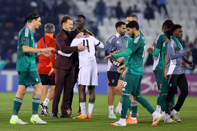 Soccer Football - Asian Champions League - Group B - Al Sadd v Al Ahli - Jassim Bin Hamad Stadium, Doha, Qatar - February 3, 2025 Al Ahli coach Matthias Jaissle with Al Sadd's Mohamed Camara after the match REUTERS/Ibraheem Al Omari