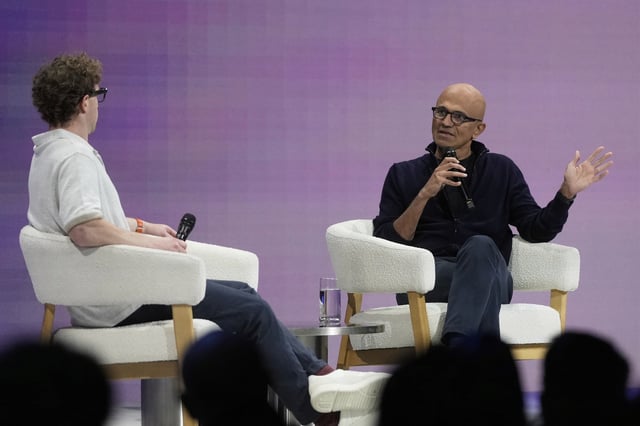Microsoft Chairman and CEO Satya Nadella, right, speaks with Meta Founder and CEO Mark Zuckerberg at LlamaCon 2025, an AI developer conference, in Menlo Park, Calif., Tuesday, April 29, 2025. (AP Photo/Jeff Chiu)