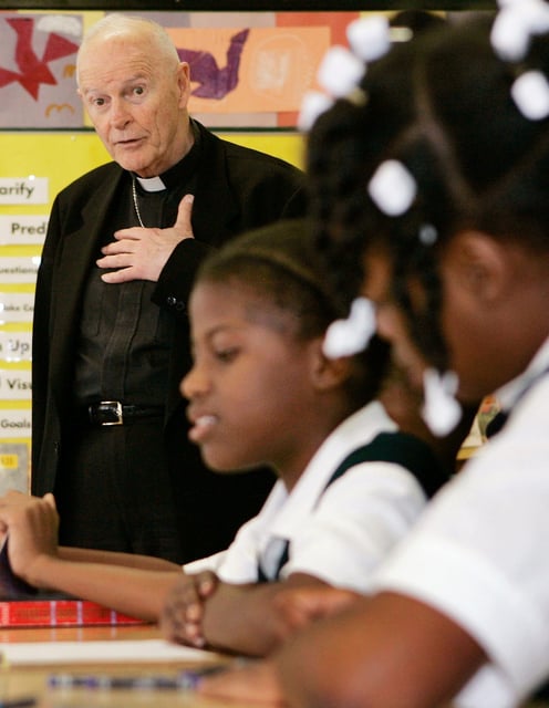 Outgoing Archbishop of Washington Cardinal Theodore E. McCarrick speaks to students as he visits a 5th grade class at the Our Lady of Perpetual Help Catholic school in Washington June 5, 2006.