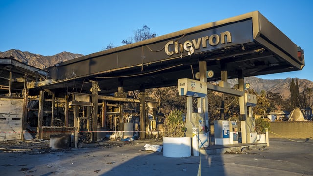 A view of a burned gas station in ruins in Altadena, California, following wildfires that swept through the city in January 2025.