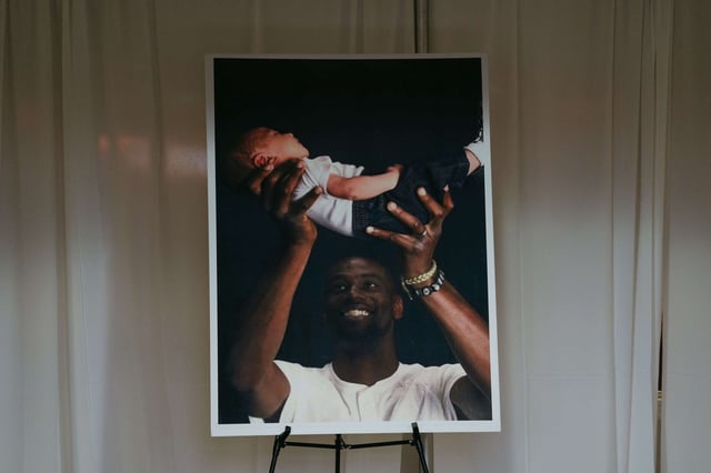 A photograph of Tyre Nichols holding his child sits in the foyer of Mississippi Boulevard Christian Church on February 1, 2023, in Memphis, Tennessee.