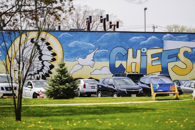 A mural adorns a wall next to the Massapequa High School, in Massapequa, N.Y., Friday, April 25, 2025. (AP Photo/Julia Demaree Nikhinson)