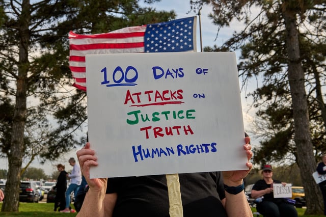 Hundreds protest outside a rally held by US President Donald Trump at Macomb County Community College in Warren, MI, Tuesday, April 29, 2025 after his first 100 days in office.