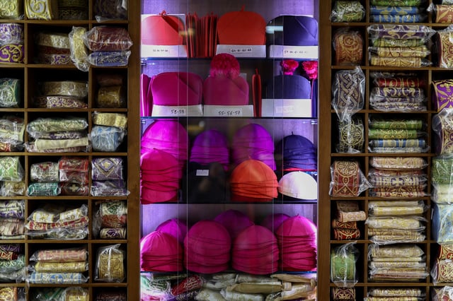 Liturgical vestments are on sale at Raniero Mancinelli liturgical vestments shop near the Vatican, in Rome, Italy, April 29, 2025. REUTERS/Guglielmo Mangiapane