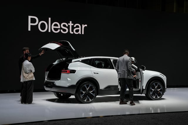 Guests look at the Polestar 4 electric SUV at the New York International Auto Show Press Preview, in Manhattan, New York City, U.S., March 27, 2024. REUTERS/David Dee Delgado/File Photo