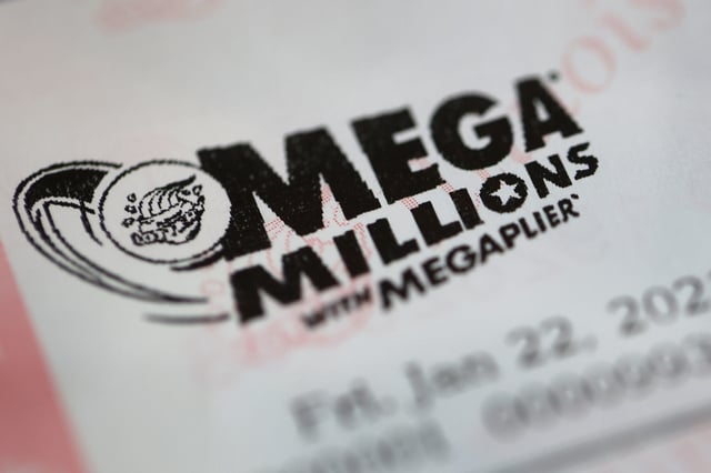 CHICAGO, ILLINOIS – JANUARY 22: Mega Millions lottery tickets are sold at a 7-Eleven store in the Loop on January 22, 2021 in Chicago, Illinois. The jackpot in the drawing has climbed to $970 million, the third highest in the game’s history.  (Photo Illustration by Scott Olson/Getty Images)