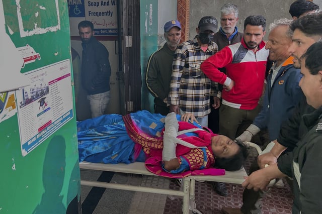 FILE - Paramedics carry a wounded tourist on a stretcher at a hospital in Anantnag after a militant attack at Pahalgam in Indian controlled Kashmir, Tuesday, April 22, 2025. (AP Photo/Dar Yasin, File)