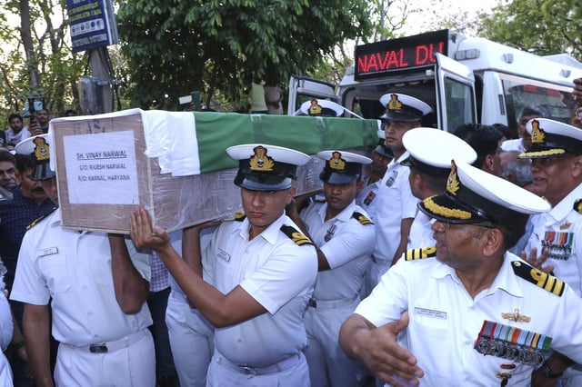 Indian naval officers carry a casket containing the body of their fellow officer Vinay Narwal, who was killed by militants at Pahalgam in Indian controlled Kashmir, during his funeral at Karnal, India, Wednesday, April 23, 2025. (AP Photo)