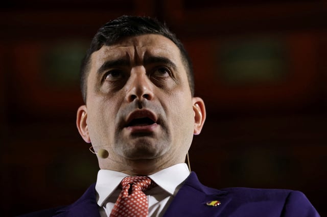 Far-right opposition leader and presidential candidate George Simion answers questions during a press conference, in Bucharest, Romania, April 11, 2025. Inquam Photos/Sabin Cirstoveanu via REUTERS
