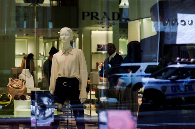 Clothes and bags are displayed at a Prada store in New York City, U.S., April 8, 2025. REUTERS/Jeenah Moon/File Photo