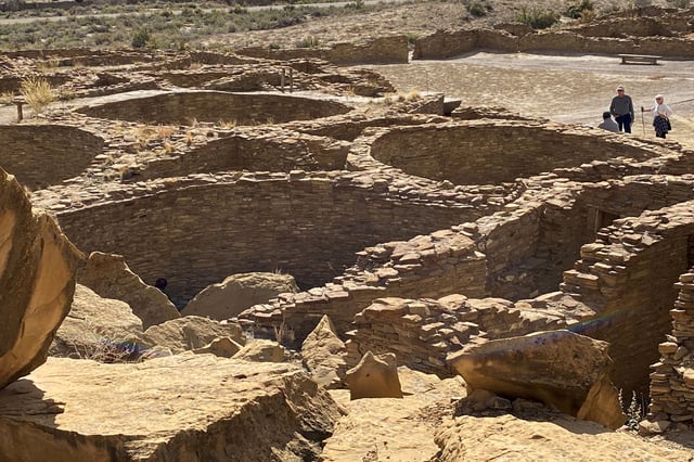 Tourists view Pueblo Bonito, one of a series of Puebloan structures in Chaco Culture National Historical Park believed to have been used as ceremonial as well as administrative and trading centers and built over multiple decades between the 9th and 12 centuries, in Chaco Canyon, New Mexico, U.S. October 21, 2021. REUTERS/Dan Grebler/File Photo