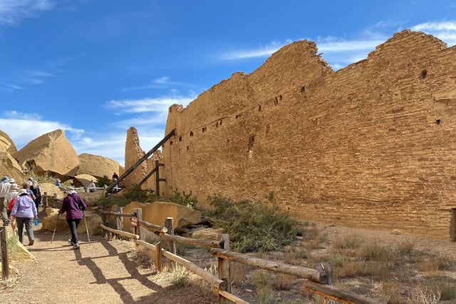 Tourists view Pueblo Bonito, one of a series of Puebloan structures in Chaco Culture National Historical Park believed to have been used as ceremonial as well as administrative and trading centers and built over multiple decades between the 9th and 12 centuries, in Chaco Canyon, New Mexico, U.S. October 21, 2021. REUTERS/Dan Grebler/File Photo