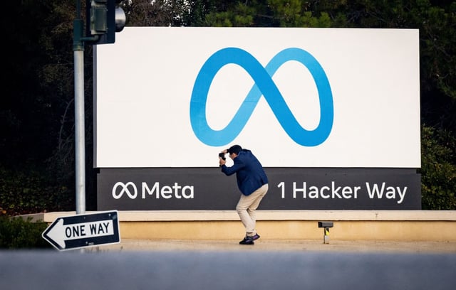 A man takes a photo at Meta (formerly Facebook) corporate headquarters in Menlo Park, California on Nov. 9, 2022. (Josh Edelson/AFP via Getty Images/TNS)