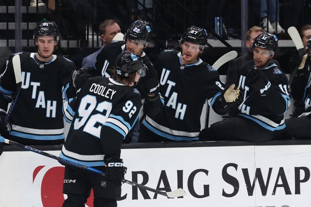 Feb 23, 2025; Salt Lake City, Utah, USA; Utah Hockey Club center Logan Cooley (92) celebrates a goal with players on the bench during the second period against the Vancouver Canucks at Delta Center. Mandatory Credit: Rob Gray-Imagn Images/File Photo