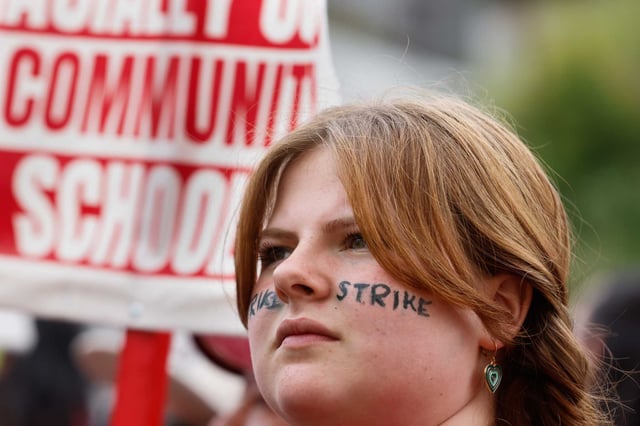 Ruby Wooliever, 12 and student at Montera Middle School and daughter of a 3rd grade teacher at Joaquin Miller Elementary School during the Oakland teacher&#39;s strike on Friday, May 5, 2023. A strike set for Thursday was averted.
