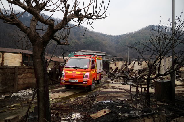 A vehicle stands amid the damage in the aftermath of a wildfire, in Yeongyang, South Korea, March 28, 2025. REUTERS/Kim Hong-Ji/File Photo