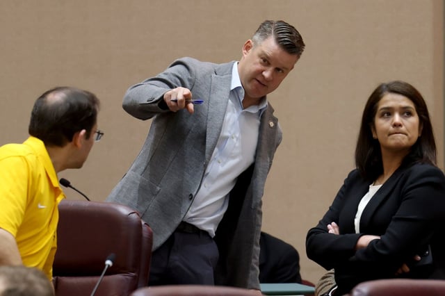 Ald. Bill Conway, 34th, is flanked by Ald. Raymond Lopez, 15th, and Ald. Silvana Tabares, 23rd, as they talk during a meeting of City Council’s Public Safety Committee, April 30, 2025. The committee advanced a proposal to give Chicago’s top public safety leaders the power to declare “snap curfews” in an effort to curb so-called “teen takeovers.” (Antonio Perez/Chicago Tribune)