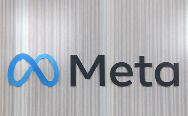 The logo of Meta is seen at the entrance of the company's temporary stand ahead of the World Economic Forum (WEF) in Davos, Switzerland January 18, 2025. REUTERS/Yves Herman//File Photo