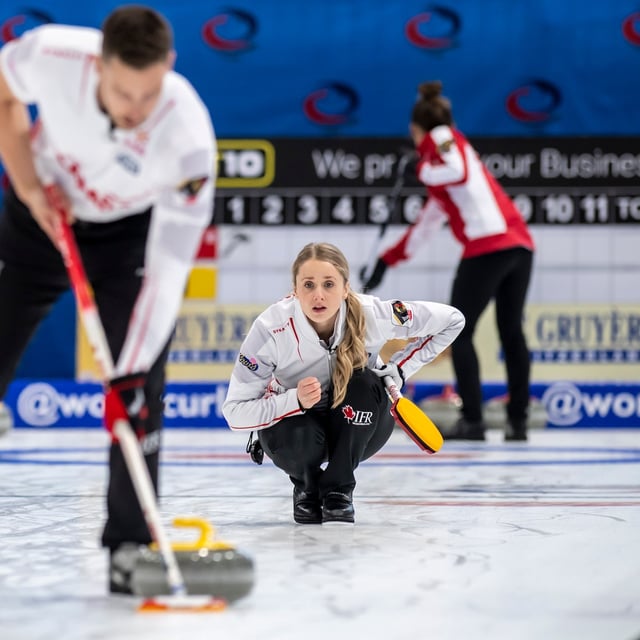 Canada's Jocelyn Peterman and Brett Gallant, left, in action during the Round Robin game between England and Canada at the World Mixed Doubles Curling Championship 2022, at the Sous-Moulin Sports Centre, in Geneva, Switzerland, Wednesday, April 27, 2022. THE CANADIAN PRESS/AP, Keystone - Martial Trezzini