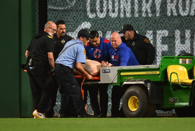 A fan is carted off the field after falling from the stands during the seventh inning of the game between the Chicago Cubs and the Pittsburgh Pirates at PNC Park on April 30, 2025 in Pittsburgh, Pennsylvania.