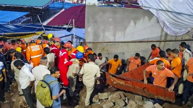 Rescue personnel and others during a rescue operation after a rain-soaked wall collapsed at the Sri Varaha Lakshmi Narasimha Swamy Temple at Simhachalam, in Visakhapatnam, Andhra Pradesh, on Wednesday (PTI)
