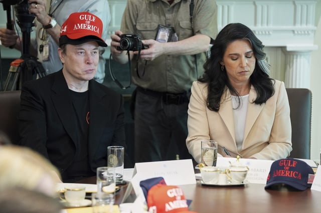 Elon Musk, left, listens as President Donald Trump speaks during a cabinet meeting at the White House, Wednesday, April 30, 2025, in Washington. (AP Photo/Evan Vucci)