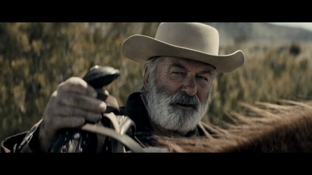 Alec Baldwin’s gruff portrayal of a ruthless killer anchors a visually stunning but rambling Western in “Rust.”