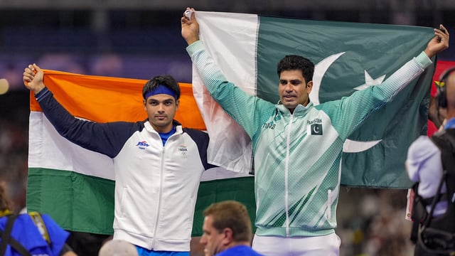 Silver medallist India's Neeraj Chopra and Gold medallist Pakistan's Arshad Nadeem celebrate after the men's javelin throw final at the 2024 Summer Olympics, in Paris