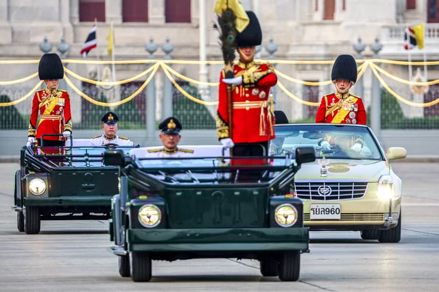 Thailand's King Maha Vajiralongkorn and Queen Suthida review the guard of honour during a trooping of the colours ceremony to mark the 72nd birthday of Thailand's King Maha Vajiralongkorn in Bangkok, Thailand, December 3, 2024. REUTERS/Athit Perawongmetha/File Photo