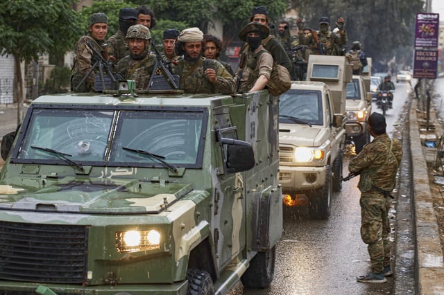Members of Syria&#39;s security forces deploy in the town of Sahnaya, south of Damascus, on Wednesday, April 30, 2025, after earlier clashes with Druze fighters left at least 11 people dead.