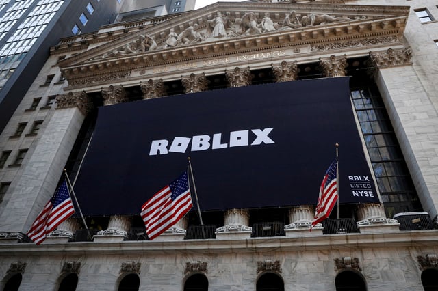 The Roblox logo is displayed on a banner, to celebrate the company's IPO, on the front facade of the New York Stock Exchange (NYSE) in New York, U.S., March 10, 2021. REUTERS/Brendan McDermid/File photo