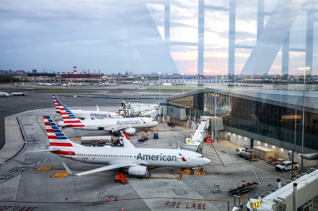 American Airlines planes at a terminal at LaGuardia airport in New York City on April 30, 2025.