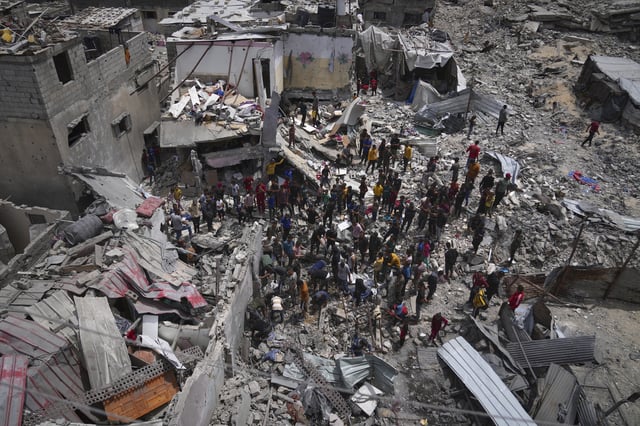 Palestinians search the rubble of a house targeted by an Israeli army strike that killed at least five people in Khan Younis, in the southern Gaza Strip, on Thursday, May 1, 2025. (AP Photo/Abdel Kareem Hana)