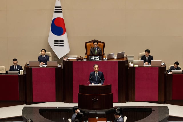 Acting president Han Duck-soo gives a speech on the government budget at the National Assembly in Seoul, South Korea, 24 April 2025. JEON HEON-KYUN/Pool via REUTERS