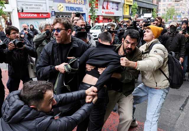 Plain-clothed police members detain a protester, as people attempt to defy a ban and march on Taksim Square to celebrate May Day in Istanbul, Turkey May 1, 2025. REUTERS/Umit Bektas