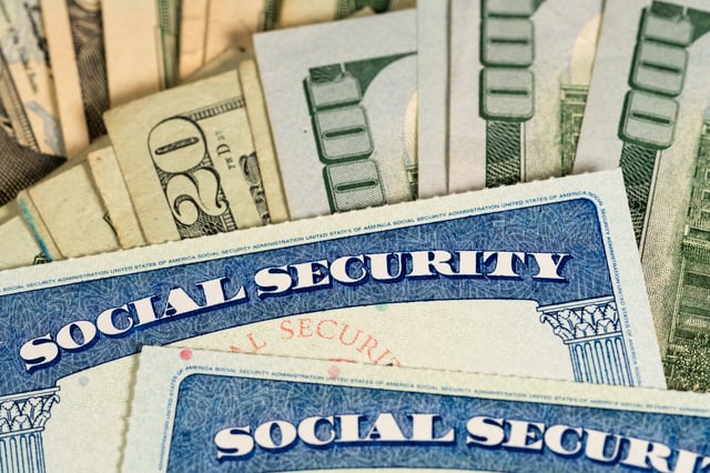 Stock image/file photo: Social Security cards with U.S. Dollars.