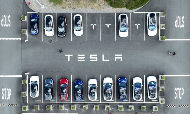 Tesla cars sit parked in a lot at the Tesla factory on April 20, 2022 in Fremont, California.