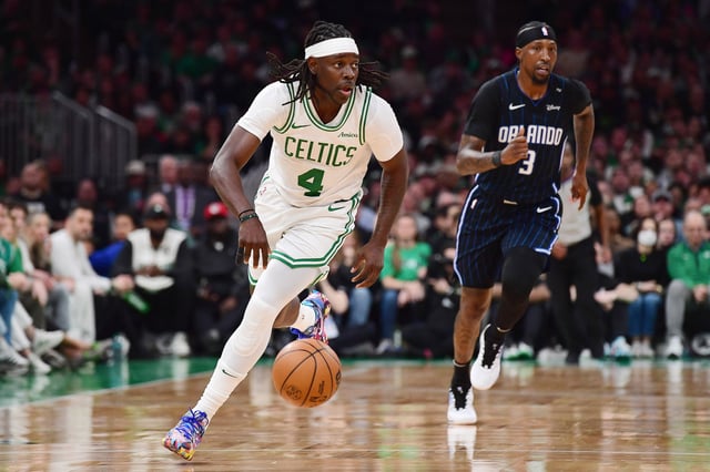 Apr 20, 2025; Boston, Massachusetts, USA; Boston Celtics guard Jrue Holiday (4) controls the ball during the second half against the Orlando Magic at TD Garden. Mandatory Credit: Bob DeChiara-Imagn Images/File Photo