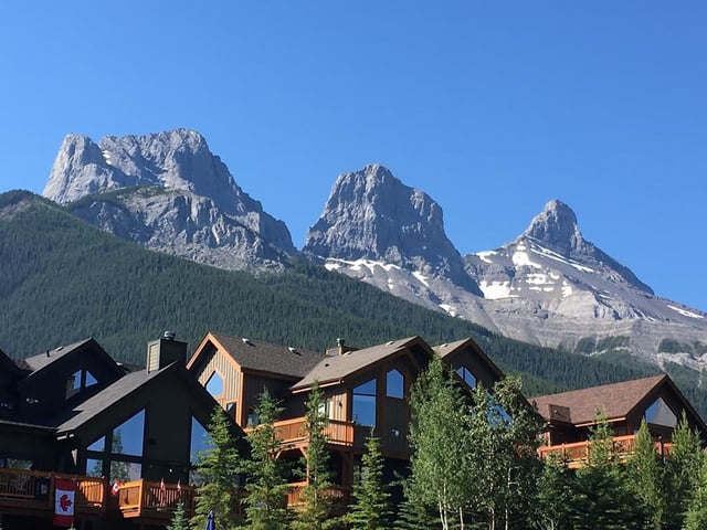 A housing development near the Three Sisters mountains on the eastern edge of Canmore, Alta., is shown on July 2, 2017. 