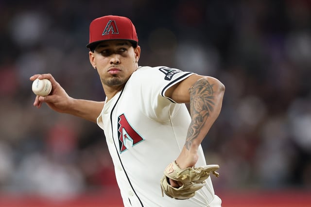 PHOENIX, ARIZONA - APRIL 27: Relief pitcher Justin Martinez #63 of the Arizona Diamondbacks throws a warm-up pitch during the ninth inning of the MLB game against the Atlanta Braves at Chase Field on April 27, 2025 in Phoenix, Arizona.
