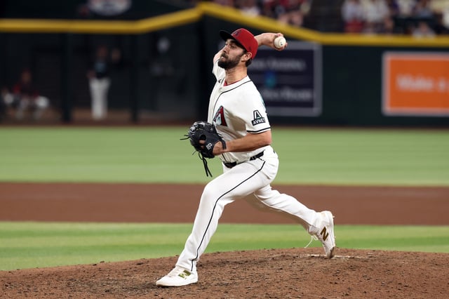 PHOENIX, ARIZONA - APRIL 24: Relief pitcher J.P. Feyereisen #61 of the Arizona Diamondbacks pitches against the Tampa Bay Rays during the game at Chase Field on April 24, 2025 in Phoenix, Arizona. The Rays defeated the Diamondbacks 7-4 in ten innings.