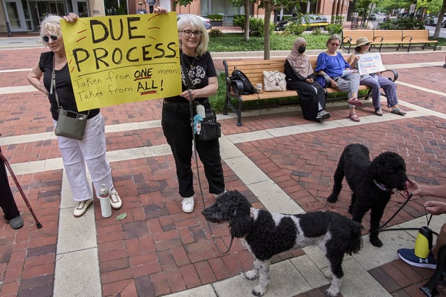 Dana Gardiner, left, and her daughter Andrea Cale, of Alexandria, Va., rally in support of Georgetown University scholar Badar Khan Suri, in opposition to his arrest and detention, before a news conference following his hearing outside of the courthouse, at the Federal District Court for the Eastern District of Virginia, in Alexandria, Va., Thursday, May 1, 2025. (AP Photo/Jacquelyn Martin)